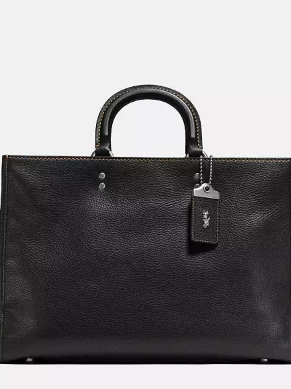 Coach Rogue Brief crafted from textured leather